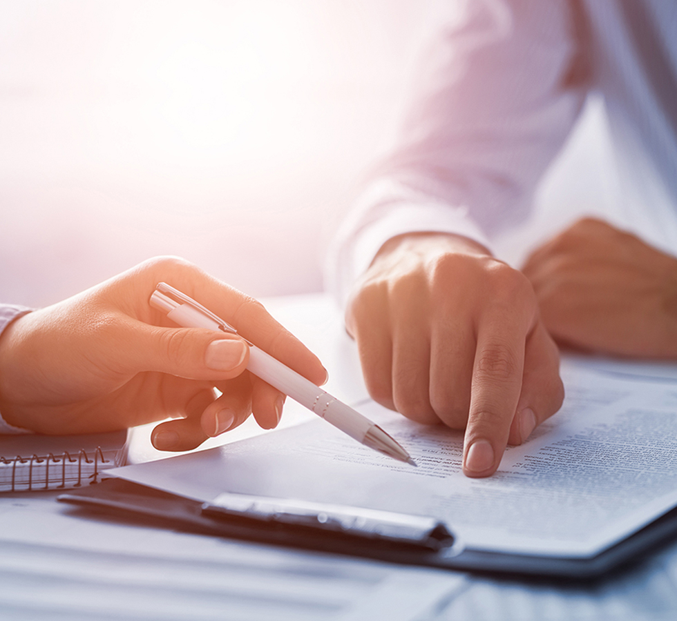 Business people negotiating a contract.
